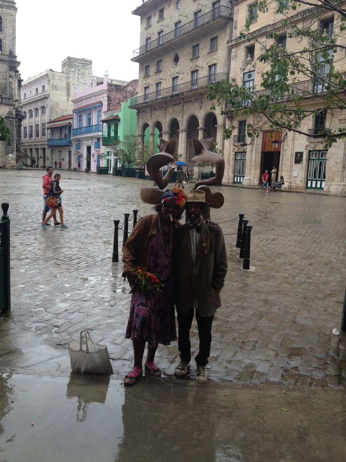 Sorry this isn't a better picture.  Two street people, both with cigards in their mouths who...